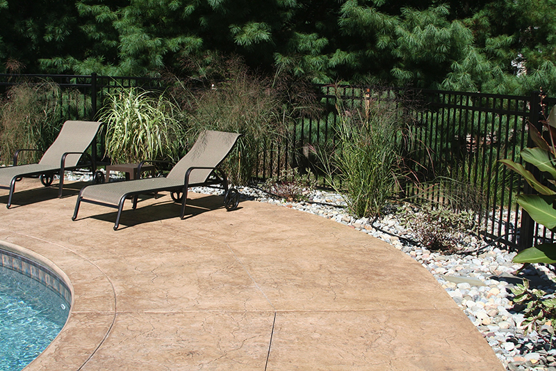Swimming pool and stamped concrete project example 76